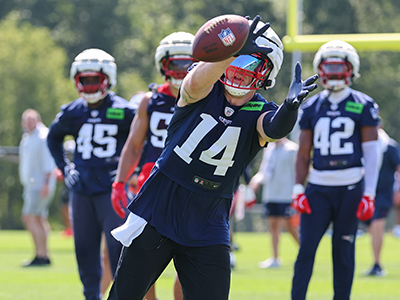 Robert Spillane catching a ball during TC.