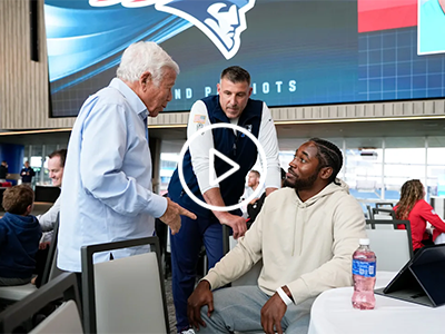 Romeo Doubs with Robert Kraft and Mike Vrabel.