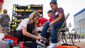 Raiders partner with the Goodie Two Shoes Foundation at Ira Earl Elementary School