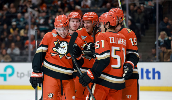 Zellweger and Vatrano celebrate a goa on the ice at Honda Center