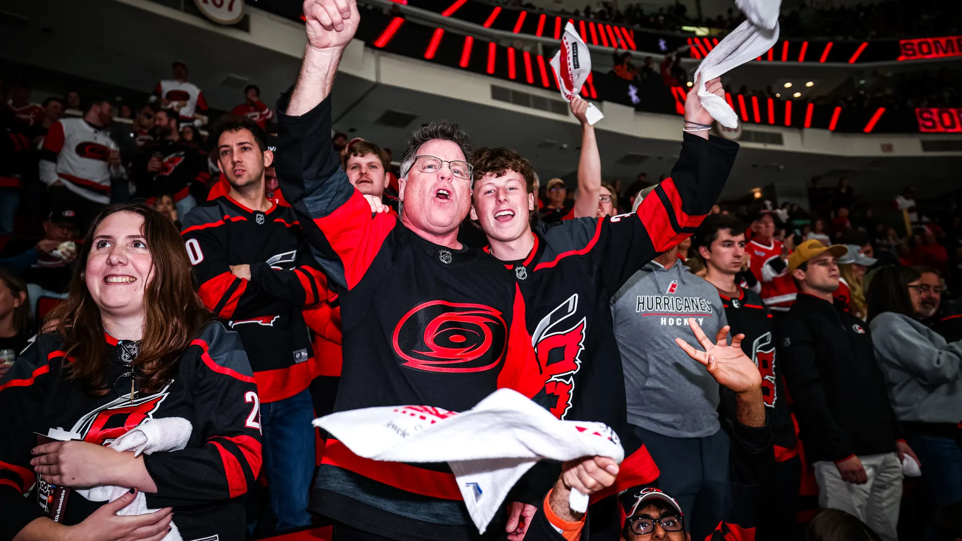 Two Caniacs cheering in Lenovo Center