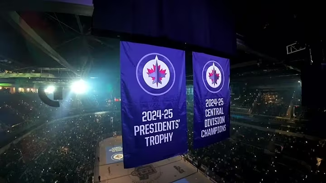 Image of 2024-25 Presidents' Trophy and 2024-25 Central Division Champions banners in the rafters of Canada Life Centre