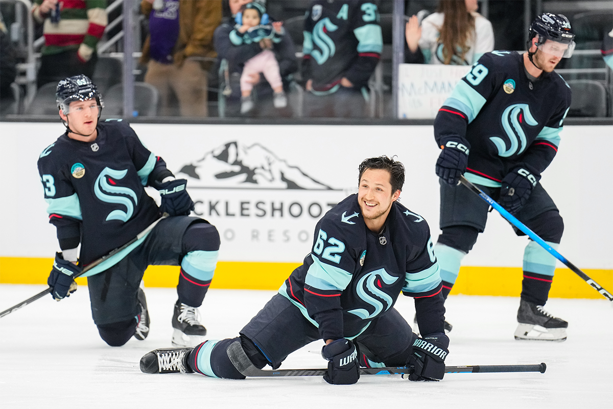 Brandon Montour stretching in his Kraken gear