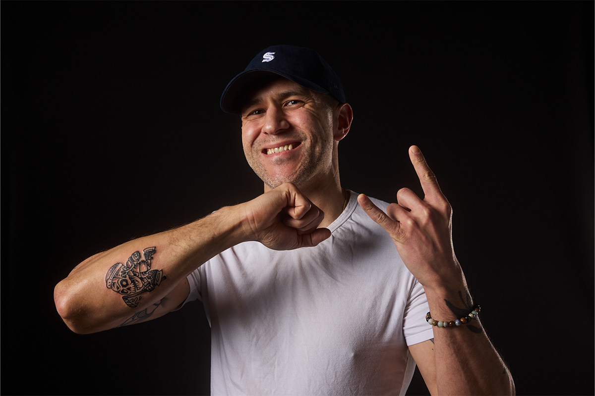 kraken fan posing with their new kraken tattoo