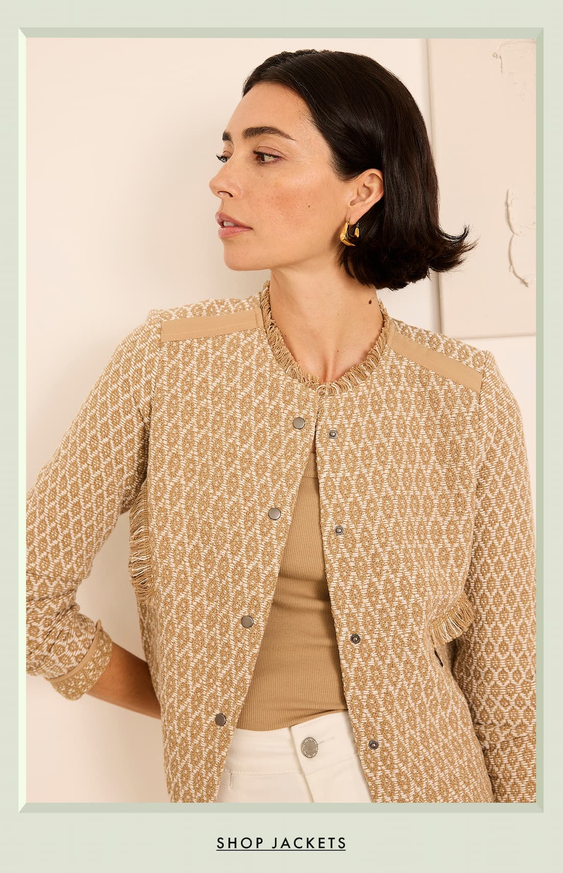 A lady wearing the Brocade Fringe Knit Jacket. Shop jackets.