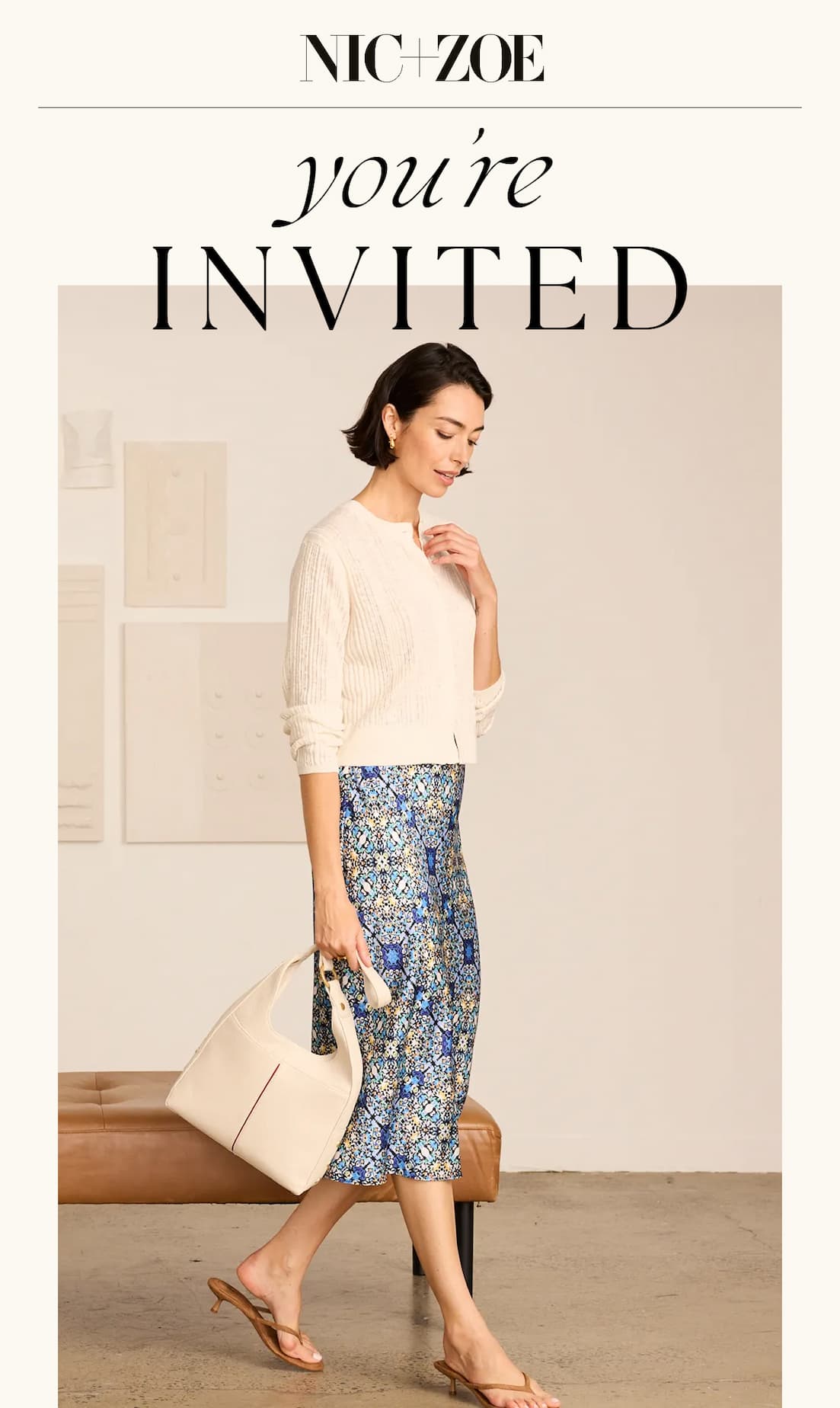 The lady wearing the new arrivals Gold Label Pointelle Stitch Cardigan and Filagree Tile Slip Skirt