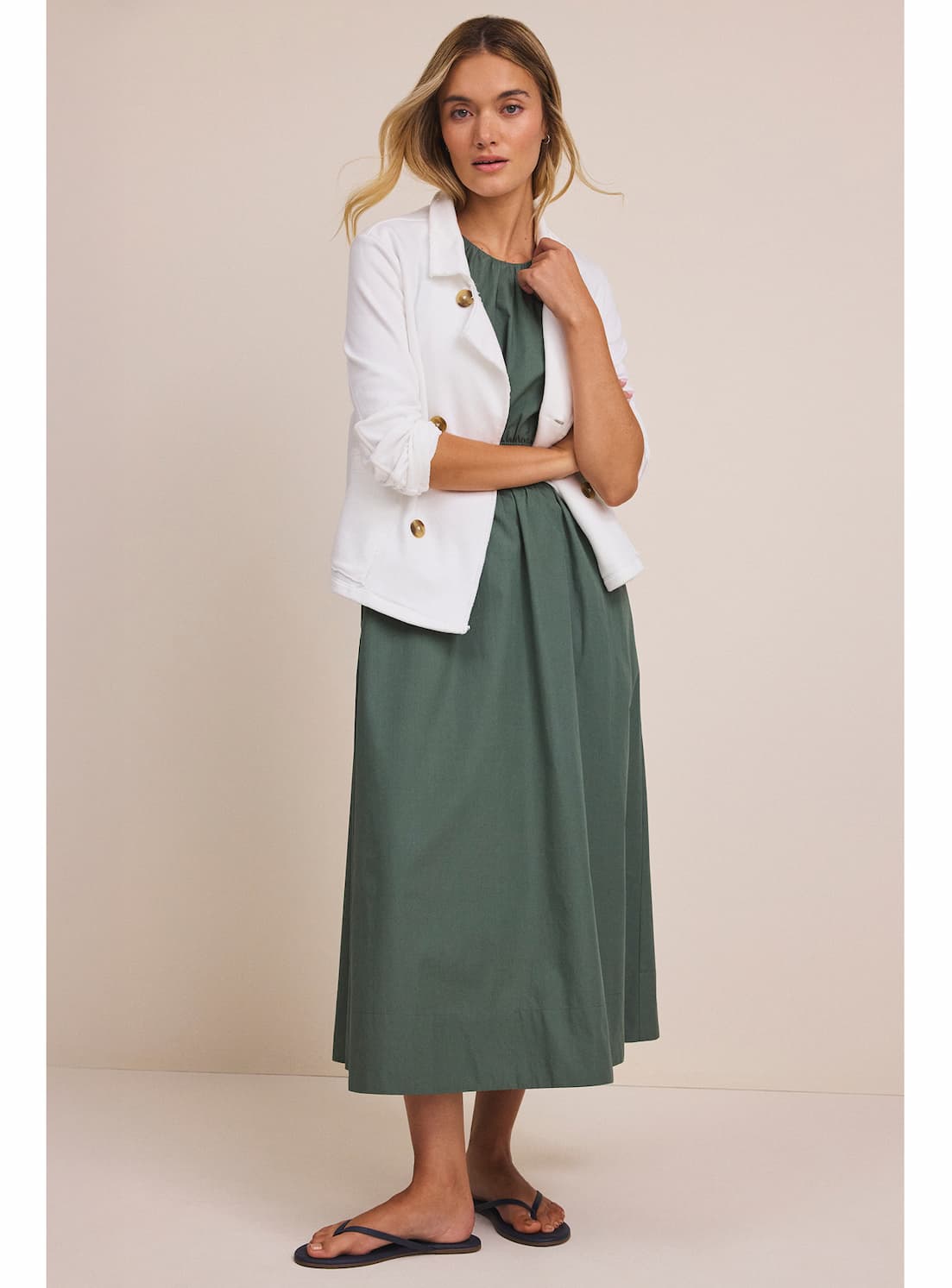 A lady wears the French Terry Daily Jacket.