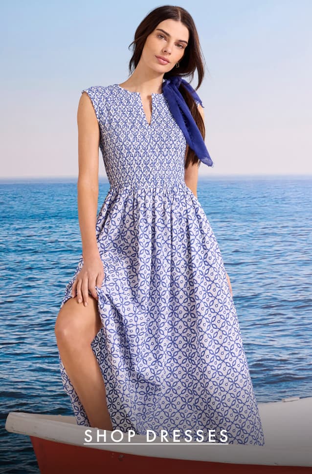 Shop dresses. The lady wearing the Embroidered Tile Amelia Dress.