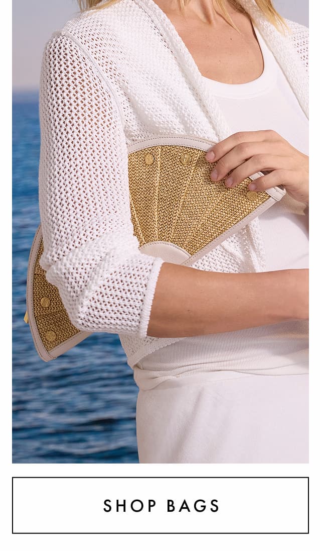 Shop bags. The lady is holding the Hammitt Shelly Clutch.