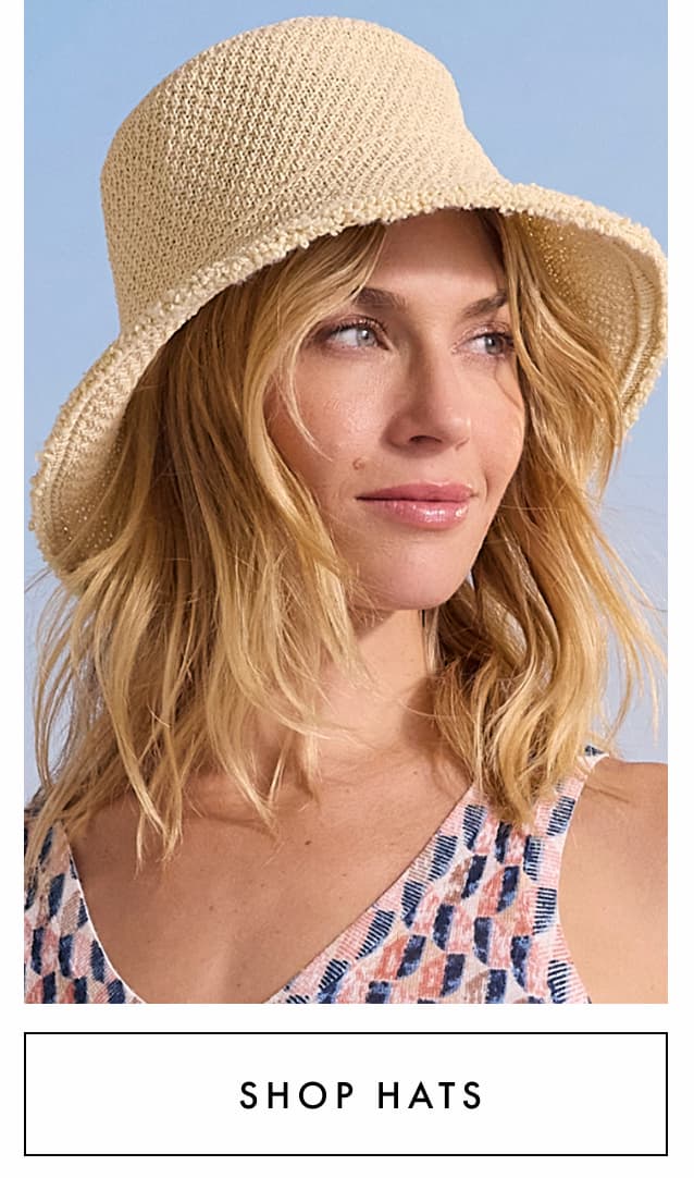 Shop hats. The lady wearing the Hat Attack Penny Woven Bucket Hat. 