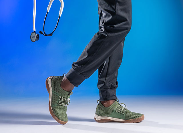 A woman wearing the Align™ Torri sneakers in green. Shop women's footwear.