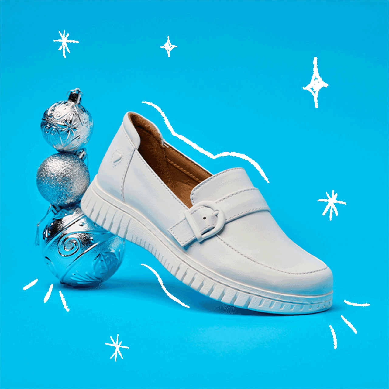 The Daisy sneaker in white and the Ultimate Nursing Bag in blue. Shop gifts under $100.