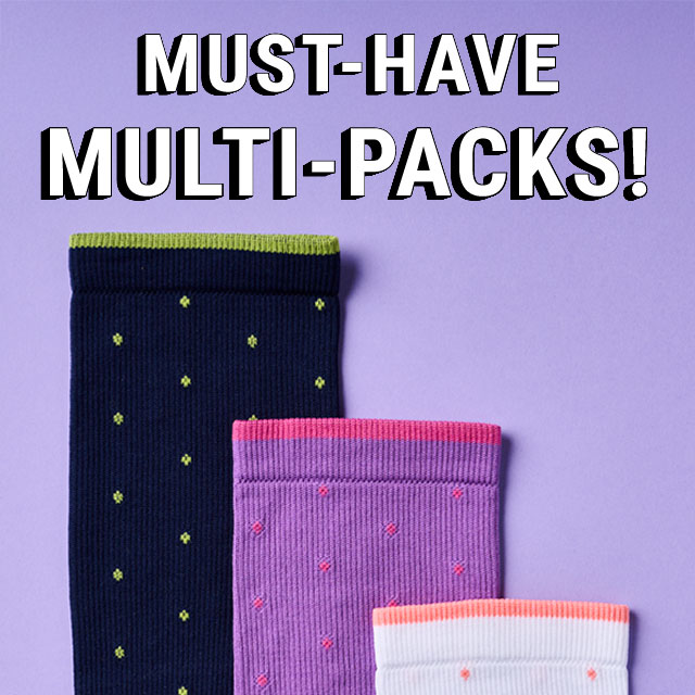 Must-have multipacks! Three multicolored socks lined up on a purple background. Shop women's multi-packs.
