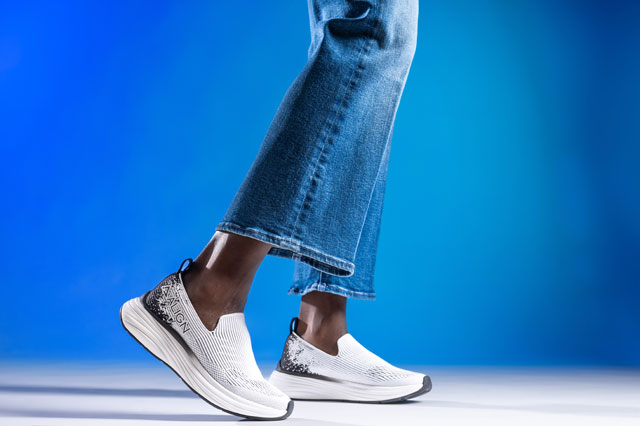 A woman wearing the Align™ thorne sneakers in white and black. Shop women's footwear.
