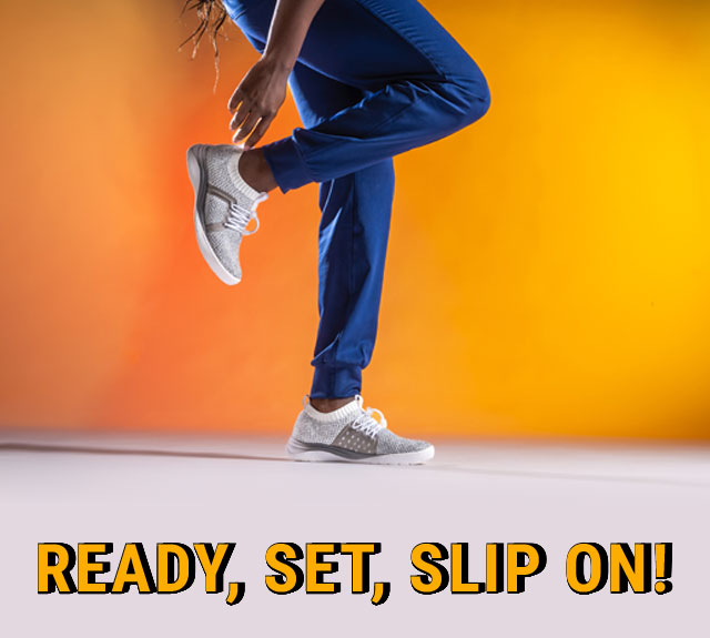 Ready, set, slip on! A woman wearing the Align™ Torri sneakers in grey.
