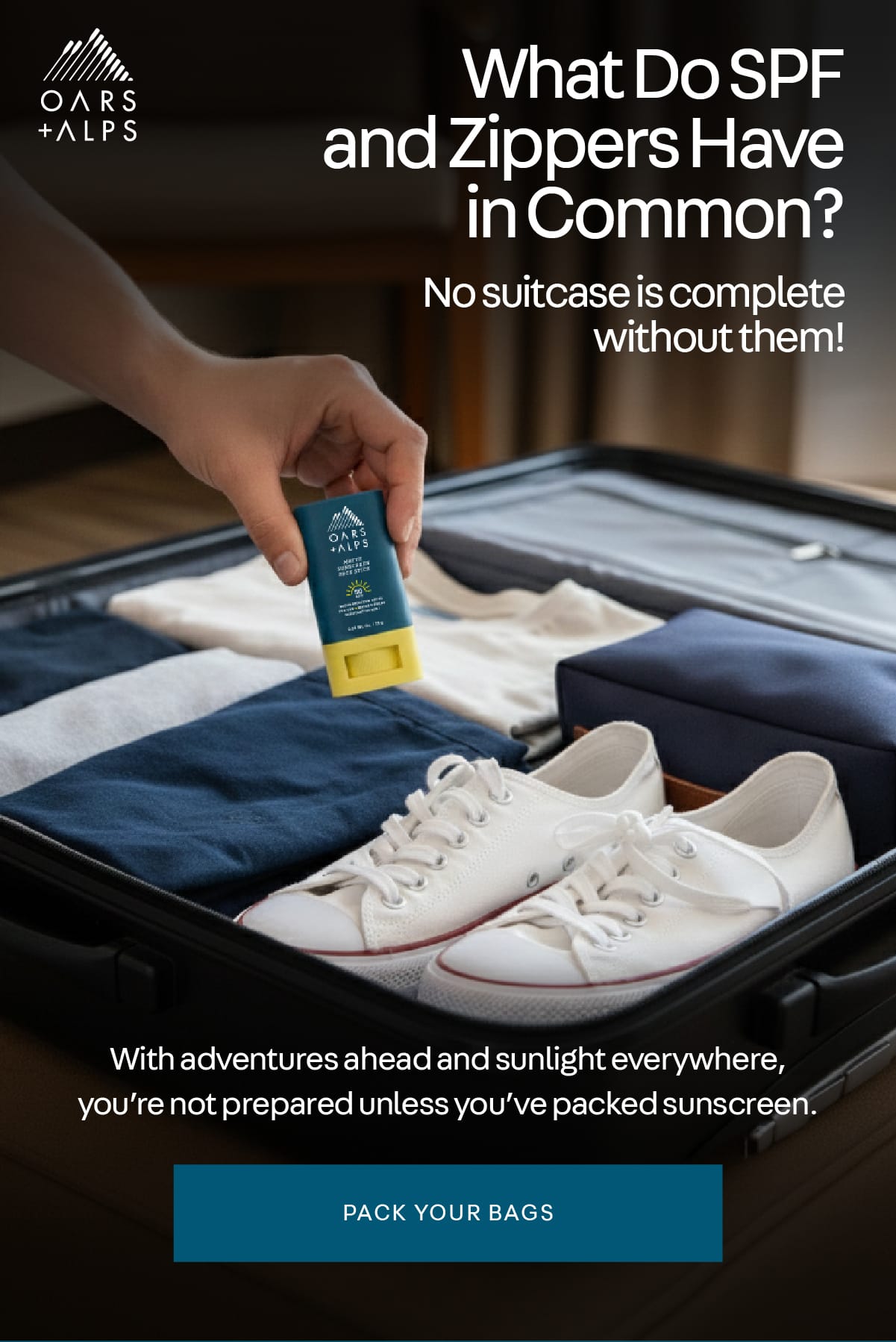 Man putting an Oars + Alps Matte Face Stick into an open, packed suitcase with folded clothes and shoes in it