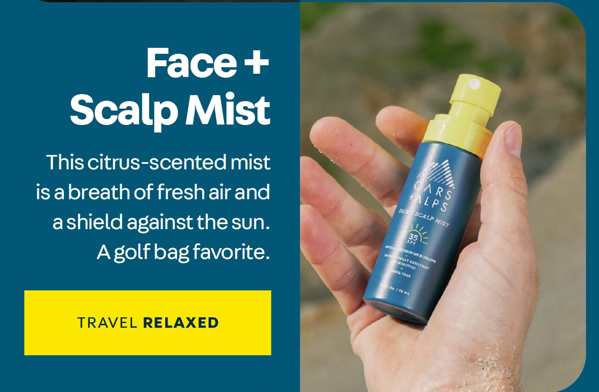 Overhead look at a bottle of Oars + Alps Face + Scalp Mist laying in a man's hand