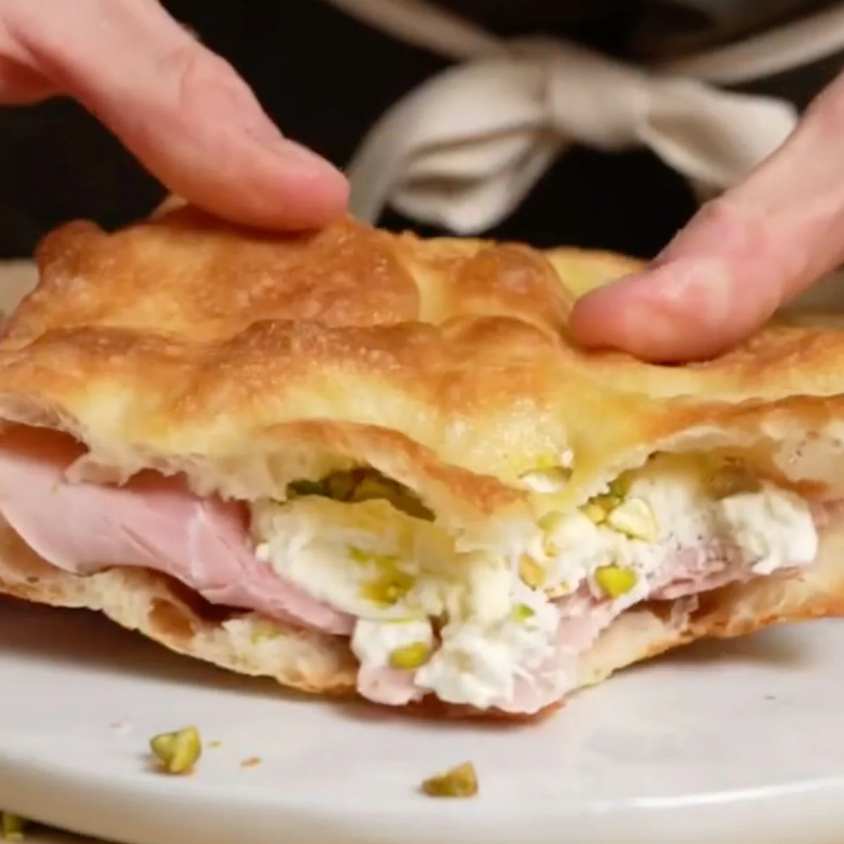 Pizza Bianca sandwich made with burrata and mortadella.