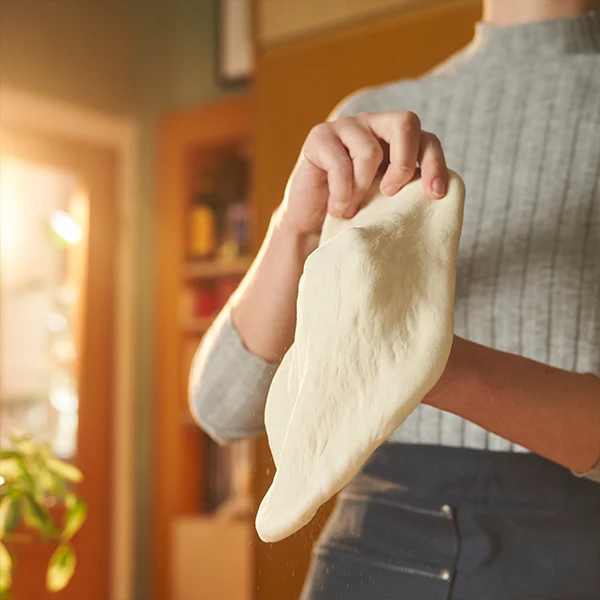 Hands kneading dough