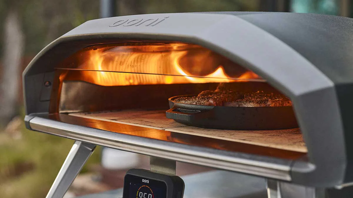 Steak being cooked in Ooni Koda 2 Pro using Ooni Cast Iron