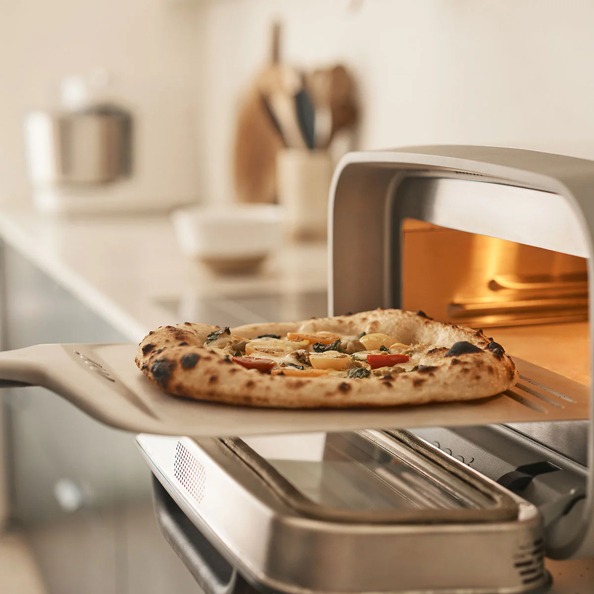 Compact Pizza Peel four-in-one use