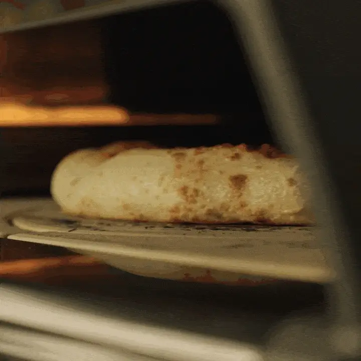 A GIF of a pizza being cooked using the Rotating Stone, showing a beautifully cooked crust.