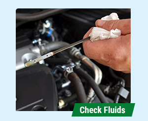 close up of checking oil on dipstick