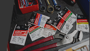 tools and grease in a tool box drawer