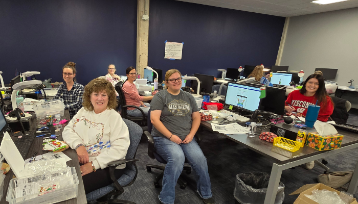 Team members at OrnamentShop.com’s Hudson, Wisconsin location personalizing ornaments for the holiday season.