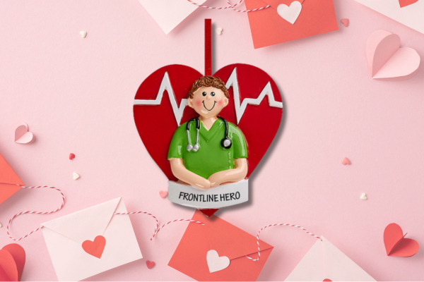 A smiling doctor in green scrubs in front of a red heart and heartbeat line—perfect for honoring healthcare heroes during Heart Health Month.