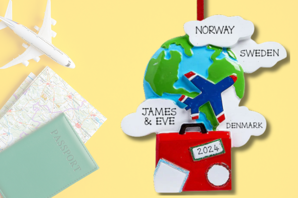 Personalized globe ornament with plane, suitcase, and country names