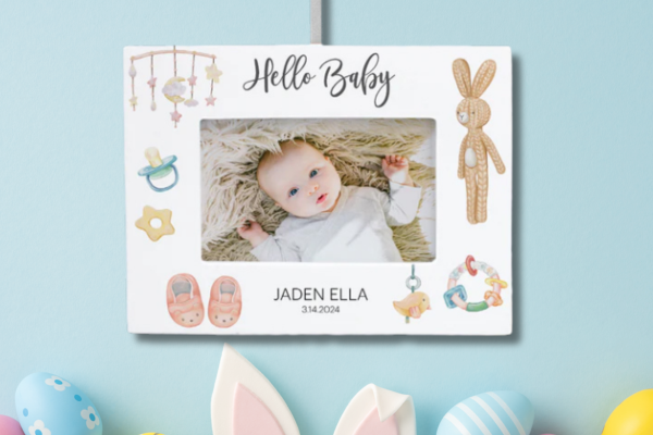 Personalized baby photo ornament with baby picture frame and name printed below.