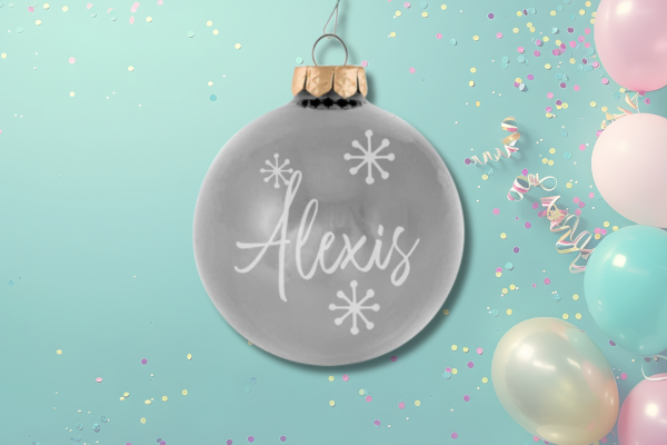 Personalized gray birthstone ornament with name and snowflake accents representing April birthdays.