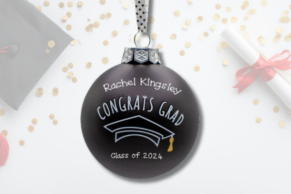 Personalized graduation ornament with cap design, school colors, and custom name and year.