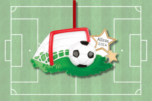 Personalized soccer ornament with goal net, ball design, custom player name, and year displayed on star accent.