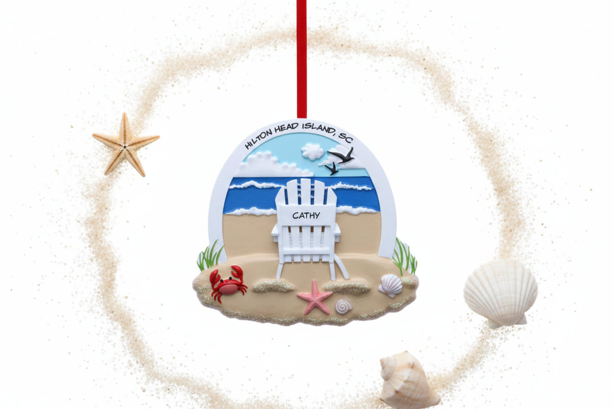 Personalized Hilton Head Island ornament featuring a beach scene with ocean waves, seashells, starfish, a red crab, and a white Adirondack chair customized with the name Cathy.