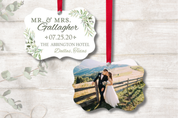 Personalized wedding photo ornament with couple picture, names, wedding date, and venue details.