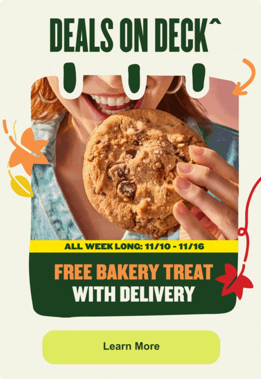 A MyPanera Days promotional banner titled DEALS ON DECK, showing a smiling person about to take a bite out of a large chocolate chip cookie. The text announces a deal running ALL WEEK LONG: 11/10 - 11/16 for a FREE BAKERY TREAT WITH DELIVERY, with a Learn More button at the bottom.