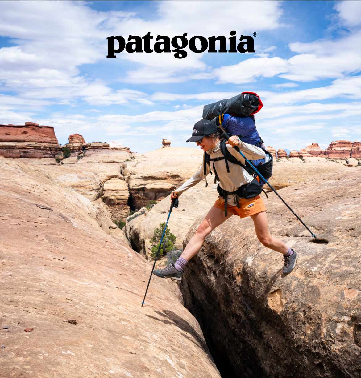 Patagonia. A person stepping over a crack in the rocks.