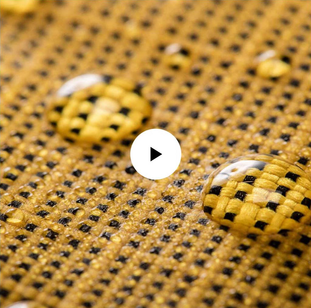 Water droplets on a garment with a play button over it.