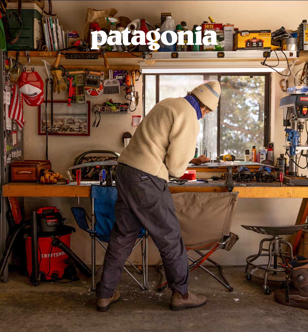 Patagonia. A person waxing their board in a garage.