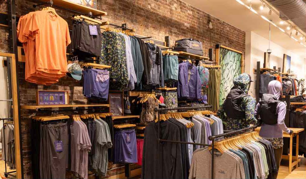 An assortment of clothing inside a Patagonia retail store.