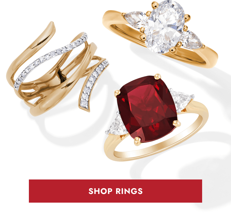 Three gold rings featuring diamond accents and a deep red gemstone. Red button to click shop rings.