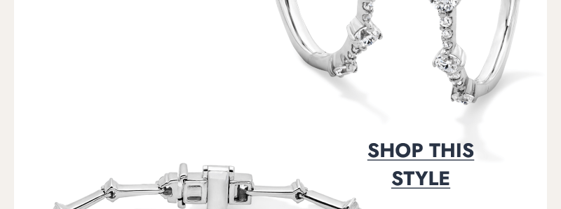 Silver diamond hoop earrings with round diamonds. Click to shop this style.
