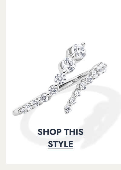 Silver bypass ring with two rows of round diamonds crossing at the top. Click to shop this style.
