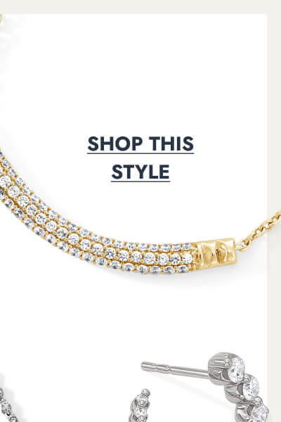 Yellow gold bar necklace with two rows of round diamonds. Click to shop this style.