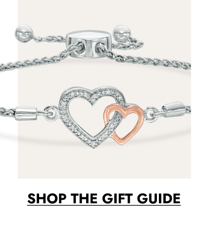 Silver bracelet with two interlocking heart charms, one accented in rose gold. Click to shop the gift guide.