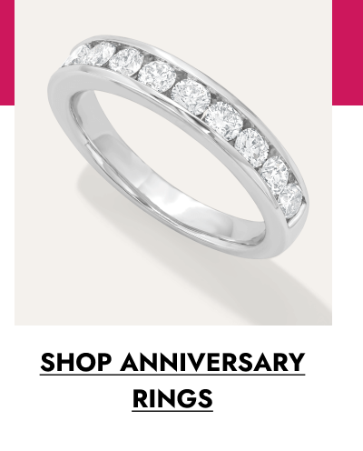 White gold diamond anniversary band with a row of round diamonds. Click to shop anniversary rings.