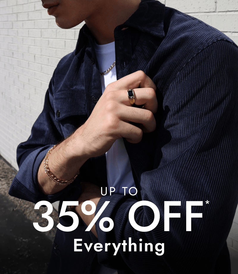 Man wearing variety of fine jewellery.
