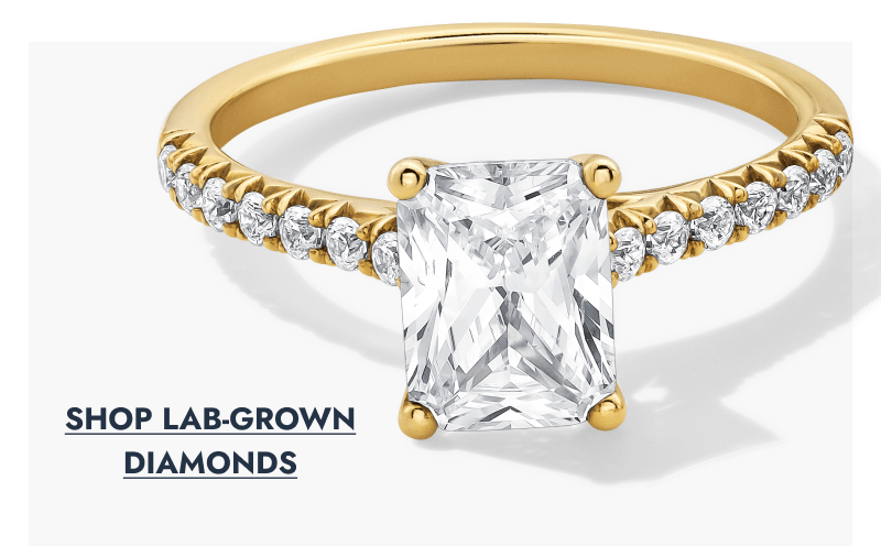 Yellow gold lab-grown diamond pave emerald engagement ring.